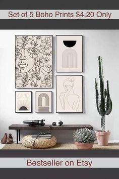 a living room with pictures on the wall and plants in vases next to it