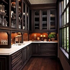 a kitchen with dark wood cabinets and white counter tops