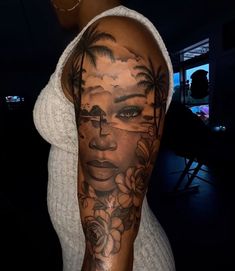 a woman's arm with tattoos on it