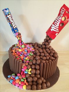 a chocolate cake with candy and candies on top