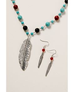 Zinc / Steel / Semi precious stone / Brass. Lobster clasp closure. French hook earrings. Stone and beaded chain. Feather charms with etching. Bohemian Turquoise Jewelry With Feathers, Adjustable Dangle Feather Jewelry, Western Style Silver Turquoise Necklace, Nickel Free, Adjustable Southwestern Hand-strung Turquoise Necklace, Silver Southwestern Multi-stone Turquoise Necklace, French Hook Earrings, Southwestern Style Nickel-free Blue Turquoise Necklace, Midnight Sky, Cowgirl Jewelry