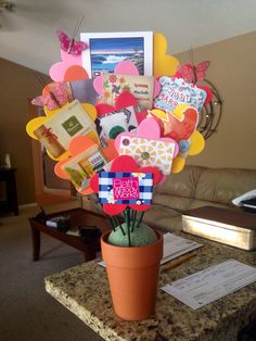 a vase filled with lots of cards and flowers