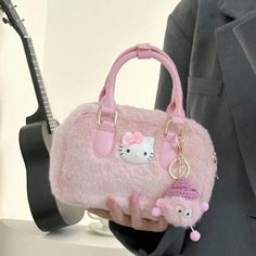 Kawaii Aesthetic Pink Hello Kitty Purse Handbag Crossbody Bag Embrace the epitome of kawaii charm with the Kawaii Aesthetic Pink Hello Kitty Purse Handbag Crossbody Bag—a delightful accessory that seamlessly merges style and cuteness. This pink Hello Kitty purse offers versatility, allowing you to wear it as a handbag or effortlessly convert it into a crossbody bag.The plush fabric and light pink hue add an irresistibly cute touch to the bag, capturing the essence of the kawaii aesthetic. While adorned with the beloved Hello Kitty character, the bag's stylish shape ensures it avoids appearing overly childish, striking the perfect balance between playfulness and sophistication. Elevate your outfit with this adorable and functional accessory, making a statement that reflects both your love f Aesthetic Pink Hello Kitty, Kawaii Aesthetic Pink, Hello Kitty Purse, Hello Kitty Bag, Hello Kitty Cartoon, Beg Tangan, Plush Bags, Pink Hello Kitty, Girls Handbags