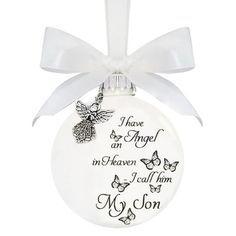 a white ornament with an angel on it and the words i have been in heaven