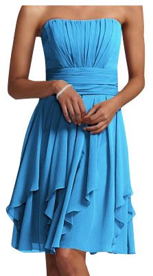 a woman in a strapless blue dress