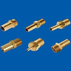 four brass fittings for different types of pipes and hoses on a blue background