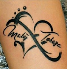 a tattoo on the leg of a woman with an infinite love symbol and words written in cursive font