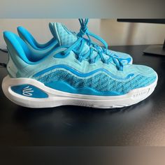 Men’s Size 13/Women’s 14.5 Curry 11’s - Limited Edition Light Blue And White Basketball Shoes. Unworn, In The Box. Bought Them Just Before Someone Else Bought Them For Me, So I Don’t Need Them Anymore. Actually Fits Men’s Size 12-13 (Molds To Your Feet). Super Comfortable! Retails For $140. Will Take $120 Or Best Offer! Under Armour Blue Running Sneakers, Blue Under Armour Running Sneakers, Under Armour Low-top Basketball Shoes With Cushioned Footbed, Under Armour Low-top Breathable Basketball Shoes, Under Armour Breathable Low-top Basketball Shoes, Under Armour Basketball Shoes For Light Sports, Curry Basketball Shoes, Light Blue Shoes, White Basketball