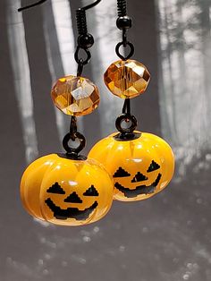 These adorable Jack O' Lantern Bell Earrings would make a great addition to your Autumn and Halloween wardrobe.   They are cute and fun.   The Jack O' Lantern is a BELL How cool is that? Jack' doesn't need to be hidden until All Hallows Eve! The Earrings come in two styles. Large: = 2 inches long with the hooks as pictured and is made with an Orange Crystal and  Glass bling. Small: = 1.75 inches long with the hooks as pictured and is made with an orange crystal. You choose your style when you check out. We can change the hook to a post or clip at no additional cost.  Please note that it will change the length of the earrings if we do change them to a post or clip. Did you know.... Pumpkins were once recommended for removing freckles and curing snake bites. Some Native Americans flattened s Novelty Orange Earrings For Halloween, Fun Orange Earrings For Halloween, Fun Orange Halloween Earrings, Fun Orange Jewelry For Halloween, Fun Orange Halloween Jewelry, Autumn And Halloween, Pumpkin Jewelry, Bell Earrings, Pumpkin Necklace