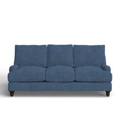 a blue couch sitting on top of a white floor