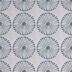 a blue and white wallpaper with an intricate design