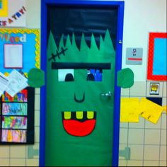 a classroom door decorated to look like a green monster