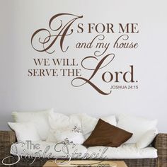 a living room with a couch and wall decal that says as for me and my house we will serve the lord