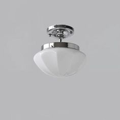 an overhead view of a ceiling light against a gray background