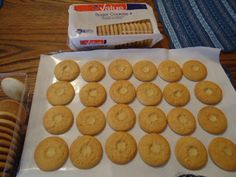 cookies and crackers are laid out on the table to be eaten by someone else