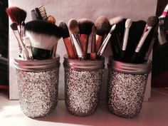 there are many makeup brushes in the jars