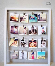 a white frame with photos pinned to it