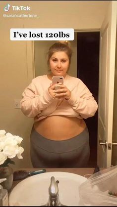 a woman taking a selfie in front of a mirror with the caption i've lost 120lbs