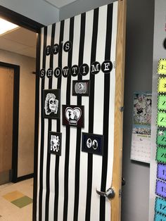 an office door decorated with black and white stripes