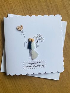 a wedding card with an image of a bride and groom holding flowers on the front