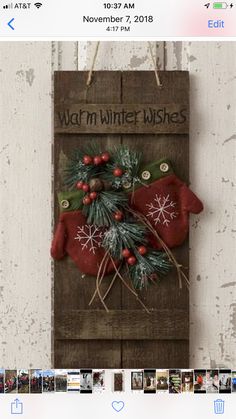 a wooden sign with christmas decorations hanging from it's side and the words warm in winter wishes