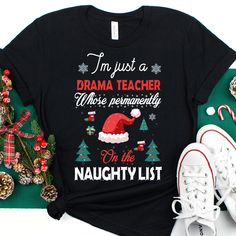 Drama Teacher Christmas Shirt, Drama Teacher Christmas Gift, Drama Teacher Christmas Tshirt, Drama Teacher Christmas Tee, Christmas Gift ❤️ This Drama Teacher shirt is the perfect gift for Christmas!🎄 𝑾𝒉𝒚 𝒕𝒐 𝒄𝒉𝒐𝒐𝒔𝒆 𝒖𝒔? 👉𝐅𝐚𝐬𝐭 𝐬𝐡𝐢𝐩𝐩𝐩𝐢𝐧𝐠 👉𝐇𝐢𝐠𝐡 𝐪𝐮𝐚𝐥𝐢𝐭𝐲 𝐡𝐚𝐧𝐝𝐦𝐚𝐝𝐞 𝐩𝐫𝐨𝐝𝐮𝐜𝐭𝐬 👉𝐆𝐫𝐞𝐚𝐭 𝐜𝐮𝐬𝐭𝐨𝐦𝐞𝐫 𝐬𝐞𝐫𝐯𝐢𝐜𝐞 - 𝐲𝐨𝐮𝐫 𝐫𝐞𝐪𝐮𝐞𝐬𝐭/𝐪𝐮𝐞𝐬𝐭𝐢𝐨𝐧/𝐩𝐫𝐨𝐛𝐥𝐞𝐦 𝐢𝐬 𝐨𝐮𝐫 𝐩𝐫𝐢𝐨𝐫𝐢𝐭𝐲 👉𝐇𝐮𝐧𝐝𝐫𝐞𝐝𝐬 𝐨𝐟 𝐬𝐚𝐭𝐢𝐬𝐟𝐢𝐞𝐝 𝐜 Christmas Tshirt, Christmas Hoodie, Bella Canvas Tees, Christmas Hoodies, Sport T-shirts, Gift For Christmas, Christmas Tees, Gifts Christmas, Unisex Shirts