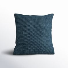 a blue pillow on a white background