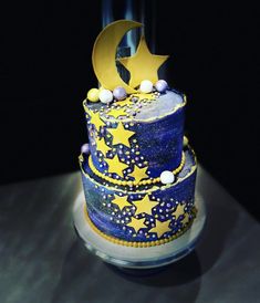 a blue and yellow cake with stars on it