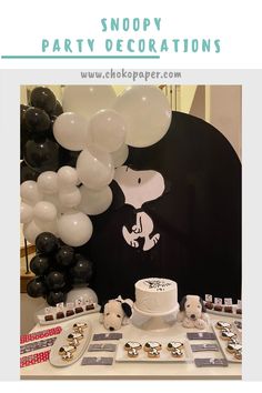 there is a table with balloons and cake on it