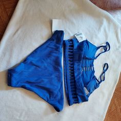 Very Cute Blue Lined Swimwear For Vacation, Blue Lined Body Tankini For Beach, Blue Lined Tankini For Beach Season, Blue Swimwear With Adjustable Straps For Pool, Blue Adjustable Straps Swimwear For Beachwear, Blue Beachwear Swimwear With Adjustable Straps, Blue Swimwear With Adjustable Straps For Beach, Blue Adjustable Straps Tankini For Beach Party, Blue Tankini With Adjustable Straps For Beach