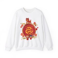 Embrace the energy of the upcoming Lunar New Year in style with our 'Year of the Dragon 2024' crewneck sweatshirt. This festive attire showcases a delightful and charming cartoon rendition of the zodiac animal, perfect for welcoming the Lunar New Year with flair. Designed with comfort and celebration in mind, it's an ideal addition to your festive Asian attire, allowing you to celebrate the Lunar New Year in comfort and style.  Chúc mừng năm mới! White Long Sleeve Sweatshirt With Front Print, Winter Crew Neck Sweatshirt With Front Print, Casual Graphic Print Tops For New Year, White Graphic Print Crew Neck Sweater, White Crew Neck Sweater With Graphic Print, New Year Crew Neck T-shirt With Letter Print, New Year's Graphic Print Crew Neck Tops, New Year Graphic Print Crew Neck Tops, White Crew Neck T-shirt For New Year