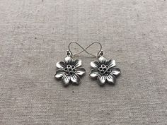 "Here are some pretty and fun silver plated flower earrings. They have wonderful detail and are lightweight and versatile. They measure 7/8\" across and hang from allergy free silver plated earwires. I have a matching necklace in my shop, if you would like the whole set." Silver Flower Earrings For Pierced Ears, Silver Flower Earrings For Spring, Spring Silver Flower Earrings, Silver Flower Shaped Earrings For Spring, Spring Silver Flower Shaped Earrings, Spring Silver Flower-shaped Earrings, Sterling Silver Flower Charm Earrings, Spring Flower Shaped Nickel Free Earrings, Silver Flower Earrings For Spring Gift