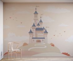 a wall with a castle mural on it and a chair in front of the wall