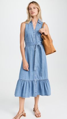 Find VERONICA BEARD Veronica Beard Edwina Sleeveless Denim Dress on Editorialist. The Veronica Beard Edwina Sleeveless Midi Dress is crafted from mid-weight, non-stretch denim. It features a collared neck, snaps at the front, a tie self-belt at the waist, and a patch breast pocket. The dress is unlined and has a length of 46.5 inches from the shoulder. The dress is made of 100% cotton and should be washed cold. Elegant Sleeveless Denim Dress For Summer, Elegant Sleeveless Summer Denim Dress, Elegant Sleeveless Denim Dress, Fitted Sleeveless Denim Midi Dress, Spring Sleeveless Denim Dress For Work, Sleeveless Denim Dress For Work, Sleeveless Denim Dress For Summer Workwear, Fitted Denim Sleeveless Dress, Casual Sleeveless Denim Dress For Work