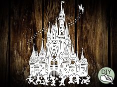 an image of a disney castle cutout on wooden background with the words diy