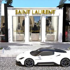 a white sports car is parked in front of a store with palm trees and people