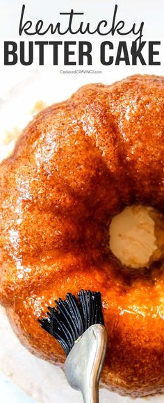 a close up of a doughnut on a plate with a brush in the middle