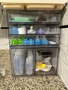 three clear containers filled with different types of cleaning products