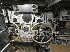 the inside of an old machine with many gauges and dials on it's face