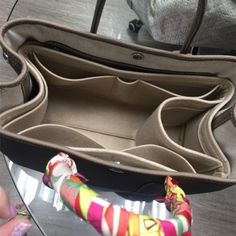 a woman's handbag sitting on top of a glass table