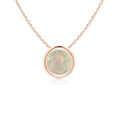 The mesmerizing round opal appears to be floating on the chain. It is secured in a 14k rose gold bezel setting. This simple yet alluring opal pendant is designed to make an elegant style statement with its stunning play of colors. 14th Wedding Anniversary, Solitaire Pendant Necklace, Solitaire Pendant, Yellow Gold Chain, Opal Pendants, Fine Jewellery Necklace, Bezel Setting, Meaningful Gifts, Elegant Style