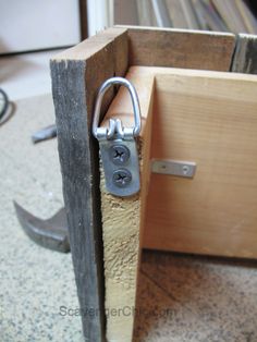 an open wooden door with a lock on it