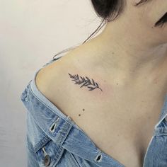 a woman with a small tattoo on her chest