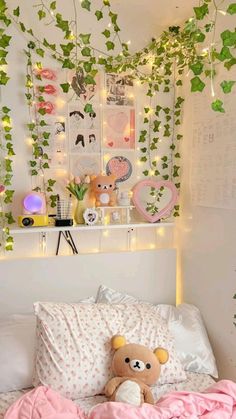 a teddy bear sitting on top of a bed in a room with ivy covered walls