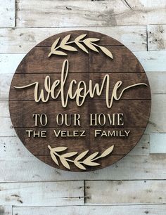 a wooden sign that says welcome to our home