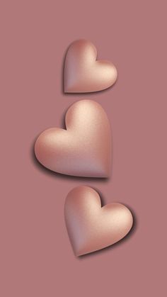 two pink hearts on a brown background