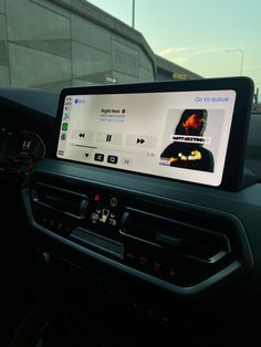 the dashboard of a car with an electronic device on it