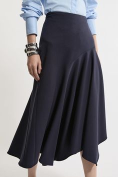 Elevate Your Occasion Wear Wardrobe With Our Midi Skirt, With A Flared Silhouette, And An Asymmetric Hemline Which Gives A Unique Edge. Style It With The Matching Jacket And Strappy Heels For An Occasion Look That Is Guaranteed To Turn Heads Wherever You Step. Tailored Asymmetric Drape Midi Skirt High Quality Crepe Fabric Flared, Relaxed Fit Unique Asymmetric Hemline Comfortable, High Waistline Asymmetrical Pleated Skirt For Work, Asymmetrical Hem Lined Skirt For Work, Versatile Asymmetrical Workwear Skirt, Versatile Asymmetrical Skirt For Work, Workwear Skirt With Asymmetrical Hem And Lining, Asymmetrical Hem Skirt For Workwear, Fitted Asymmetrical Draped Skirt For Workwear, Modern Skirt With Asymmetrical Hem For Work, Fitted High-low Hem Skirt For Work