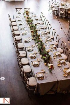 an overhead view of a long table set with place settings