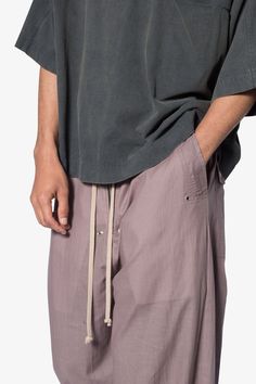 the Gauze Layered Rave Pants are designed with a new oversized rave fit, constructed from a cotton fabric shell and polyester lining with a rinse wash, and finished with a contrast drawcord. details ultra baggy fit throughout shell: 100% cotton lining: 100% Polyester extended inseam model is 6’1, 140 lbs and wears a size 30 Rave Fit, Rave Pants, 140 Lbs, Nylon Pants, Baggy Fits, Denim Wash, Short Tops, Cargo Pants, Black Pants